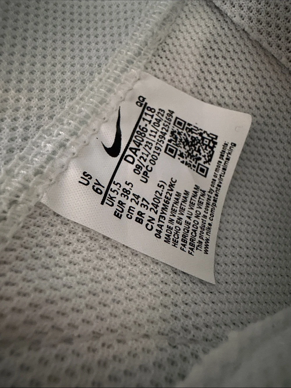 Nike Blazers High-Top Sneakers with Pink Swoosh Accents and Yellow “Nike”